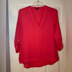 Express coral colored roll sleeve v neck blouse.